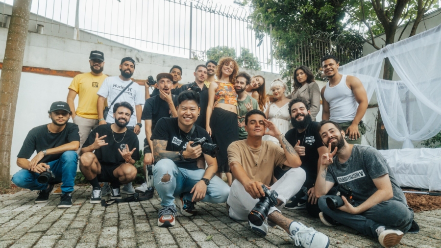 Diverse group of friends having fun and posing for a group photo outdoors in São Paulo.